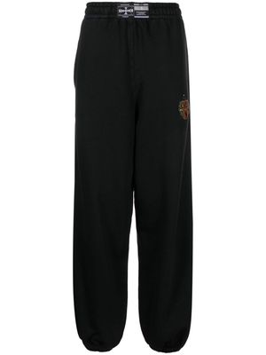 032c crest-detail organic cotton track pants - Black