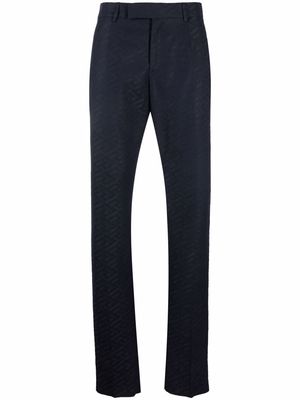Versace monogram pattern tailored trousers - Blue