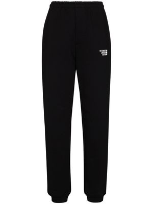 VETEMENTS logo-embroidered tapered track pants - Black