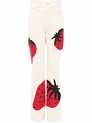 JW Anderson strawberry-print bootcut jeans - White