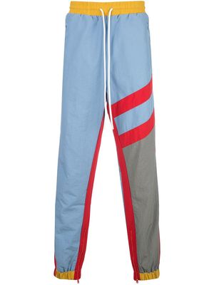 God's Masterful Children striped track trousers - Blue