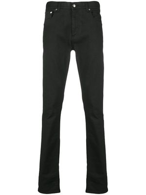 Alexander McQueen logo-studded slim-fit jeans - Black