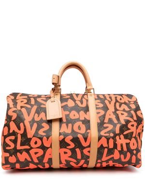 Louis Vuitton 2009 pre-owned graffiti monogram Keepall 50 travel bag - Orange