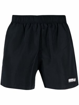 VETEMENTS logo-patch swimming shorts - Black