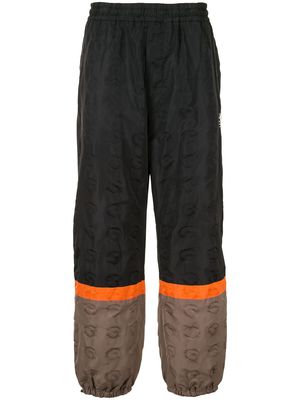 UNDERCOVER colour-block track pants - Black