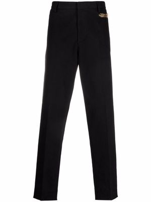 Moschino logo embellished tailored trousers - Black