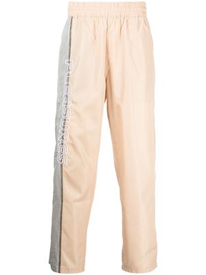 Pleasures Reality logo-embroidered trousers - Neutrals
