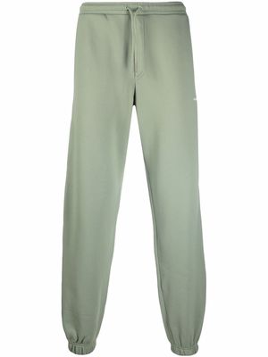 Holzweiler logo-print track pants - Green
