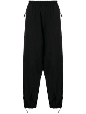 UNDERCOVER tapered track trousers - Black