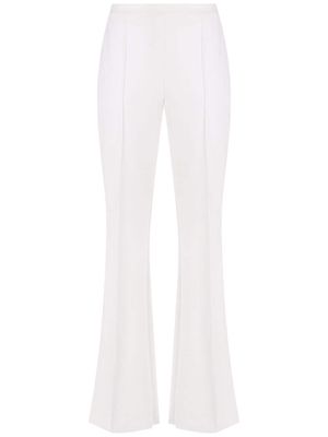 Alcaçuz high-waisted press-crease trousers - White