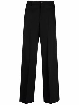 Balenciaga pressed-crease four-pocket flared trousers - Black