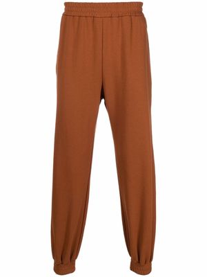 Koché embroidered-logo tapered trousers - Brown