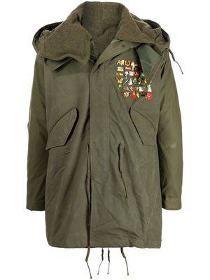 Readymade pin-embellished fishtail parka - Green