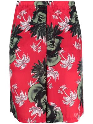 UNDERCOVER graphic-print track shorts - Red