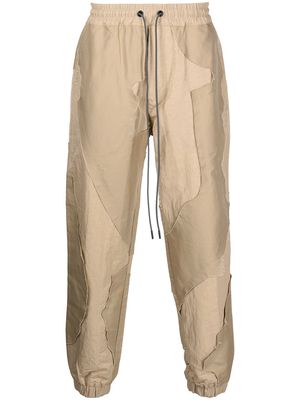 Mostly Heard Rarely Seen two-tone patchwork track pants - Brown