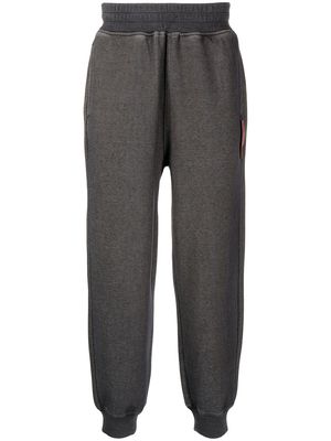 izzue garment-dyed tapered track pants - Grey
