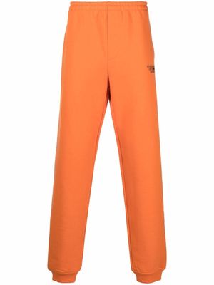 VETEMENTS logo-print track pants - Orange