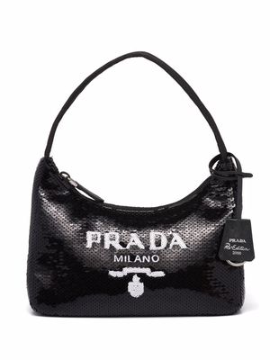 Go for utilitarian chic with Prada Nylon Tote Bag! Made from nylon with  Saffiano leather trim, gold-tone logo and hardware, luggage tag…