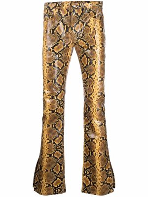Gcds snakeskin-print flared trousers - Yellow