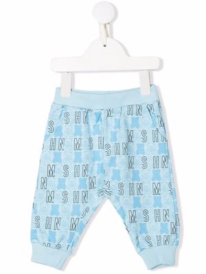 Moschino Kids all-over logo-print trousers - Blue