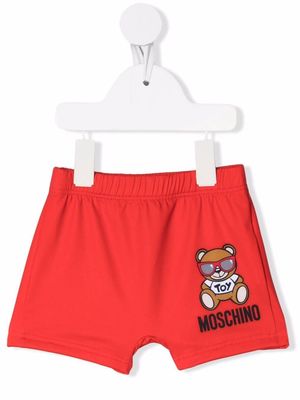 Moschino Kids logo-print swim shorts - Red