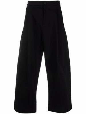 Studio Nicholson Sorte wide-leg pleated trousers - Black
