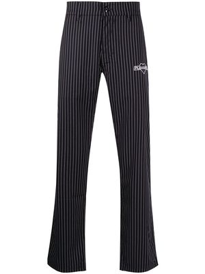 Pleasures logo-embroidered pinstripe trousers - Blue