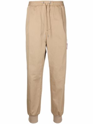 Moncler logo-patch tapered trousers - Neutrals
