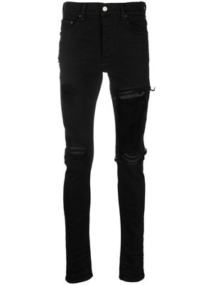 AMIRI distressed-finish ripped skinny jeans - Black