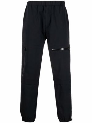 Moncler logo-patch tapered trousers - Black