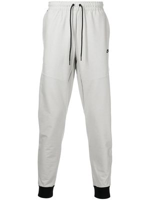 Nike logo-print tapered trousers - Grey