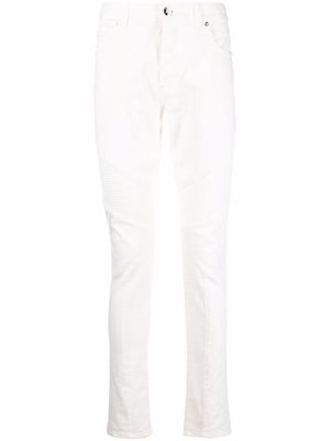 Balmain embossed-logo skinny jeans - White