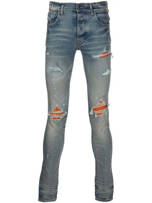 AMIRI distressed skinny-cut jeans - Blue