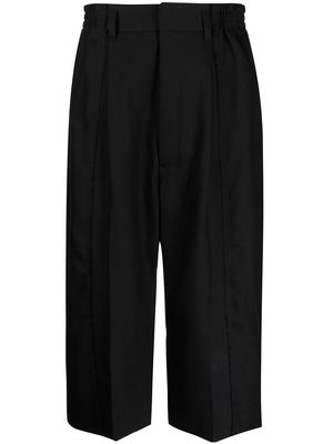 Y's pleat-detail cropped trousers - Black