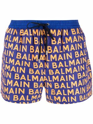 Balmain all-over logo-print swim shorts - Blue