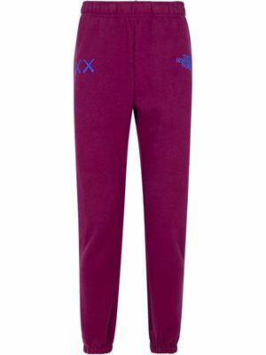 The North Face x Kaws logo-embroidered track pants - Purple