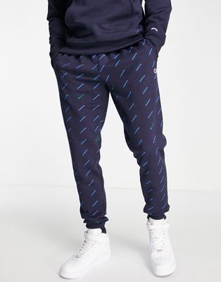 Champion all over logo print sweatpants in navy