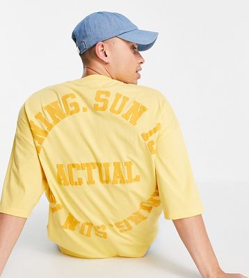 ASOS Actual oversized t-shirt with front and back slogan and logo puff print in yellow