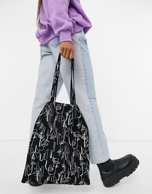 ASOS DESIGN large cotton shopper bag in abstract face print-Black
