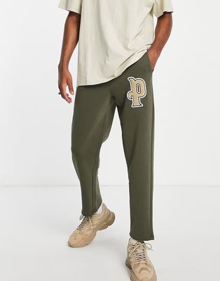 Puma varsity logo sweatpants in green