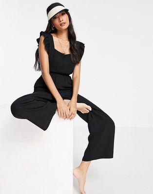 Fashion Union Exclusive frill beach jumpsuit in black