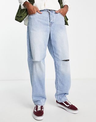 ASOS DESIGN baggy jeans in mid wash blue with knee rips-Blues