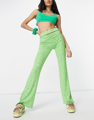 Bershka exposed seam space dye flare pants set in green