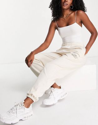 ASOS Weekend Collective oversized sweatpants with arch logo in ecru - part of a set-Neutral