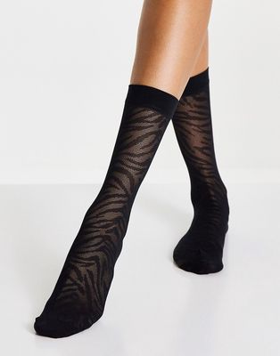 ASOS DESIGN calf length sheer socks in zebra print in black