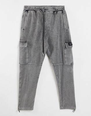 The Couture Club reverse loopback cargo pants in black acid wash