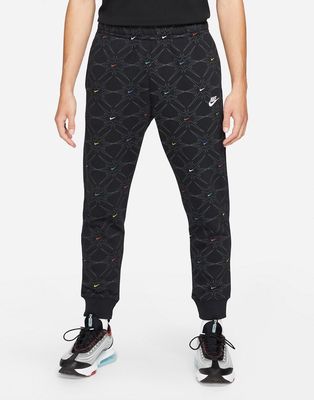 Nike Branded AOP Pack all over logo cuffed sweatpants in black/multi