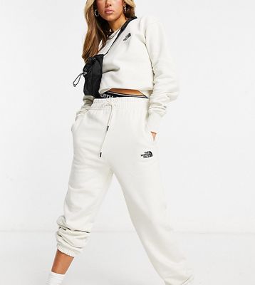 The North Face Essential oversized sweatpants in off-white Exclusive to ASOS
