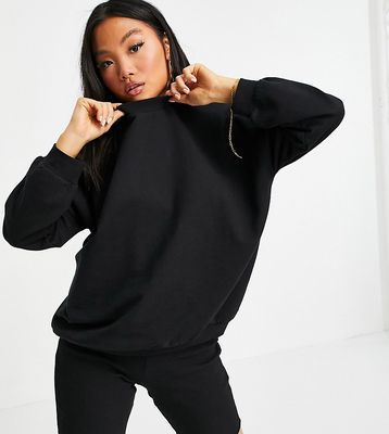 ASOS DESIGN Petite tracksuit with sweatshirt and ribbed legging shorts in black