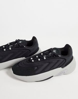 adidas Originals Ozelia sneakers in black with gray sole